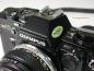 Preview: Olympus OM-10 black mit Manual Adapter und Zuiko 1.8/50mm